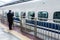 Kyoto, Japan - December 30, 2009: Stationmaster standing near N700 shinkansen bullet train departing Kyoto station