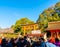 Kyoto, Japan - Jan 11, 2020 : Red Torii gates at Fushimi Inari Taisha with tourists and Japanese students. Fushimi Inari is the
