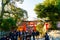 Kyoto, Japan - Jan 11, 2020 : Red Torii gates at Fushimi Inari Taisha with tourists and Japanese students. Fushimi Inari is the