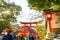 Kyoto, Japan - Jan 11, 2020 : Red Torii gates at Fushimi Inari Taisha with tourists and Japanese students. Fushimi Inari is the