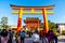 Kyoto, Japan - Jan 11, 2020 : Red Torii gates at Fushimi Inari Taisha with tourists and Japanese students. Fushimi Inari is the