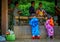 KYOTO, JAPAN - JULY 05, 2017: Young Japanese people wearing traditional Kimono and holding umbrellas in their hands in