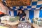 KYOTO, JAPAN - NOV 28 : Japanese woman selling grilled dango mochi at shop on the street to Fushimi Inari shrine on November