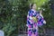 KYOTO, JAPAN - NOVEMBER, 8, 2019: Young Asian Girl Posing in Geisha Kimono in Traditional Japanese Environment in Kyoto, Japan