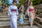 Kyoto, Japan - Two women and a little child dressing like geishas walking in a temple in Kyoto, Japan