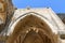 KYRENIA, CYPRUS - OCTOBER, 14 2016: Arch in the monastery church at the Bellapais Abbey Monastery in Kyrenia
