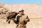 Kyrgyz hunter or Berkutchi holding a golden eagle on his hand, Kyrgyzstan.