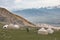 Kyrgyz traditional yurts in a high mountain valley near Kol-Ukok in the Tian Shan mountains of Kyrgyzstan at sunrise