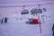 L`Alpe D`Huez, France 30.12.2019 Later evening. Cableway lift cabin background. A special machine prepares the ski slope