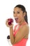 L latin sport woman in fitness clothes eating apple fruit smiling happy in healthy nutrition