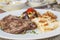 A la carte steak meal on patterned plate