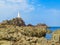 La Corbiere Lighthouse on the rocky coast of Jersey Island