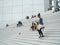 La Defense, Paris,, France, August 20 2018: people sitting and walking on the stairs of the Grand Arch