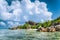 La Digue island, Seychelles. Beautiful vacation cloudscape on paradise Anse Source d'Argent beach with shallow blue