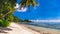 La Digue Island, Seychelles island. Famous unique tropical beach Anse Source d`Argent with sandy beach and palm trees