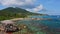 La Digue, Seychelles. Aerial view of calm waves rolling towards secluded tropical beach Anse Songe