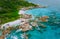 La Digue, Seychelles. Aerial view of secluded beach hidden surrounded by jungle foliage. White sand beach, turquoise