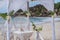 La Digue, Seychelles. Wedding arch gazebo ceremonial decorated with white flowers on a tropical grand anse sand beach