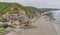 La Entrada, Ecuador - September 14, 2018 - Drone aeiral view of colorful coastal town from the beach.