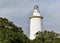 La Farola lighthouse in Malaga, an old coastal building in the harbour, Spain