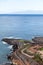 The La Gomera island is on horizon on the Atlantic ocean. Empty beach of the Playa Paraiso. Tenerife, Canary islands. Spain
