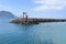 `La Graciosa` harbor dike with Lanzarote island in the background