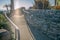 La Jolla, California- Concrete walkway with stone walls and metal bar handrails