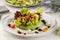 LA MEDITERRANEENE fresh salad served in a dish isolated on table side view of arabian salad healthy food