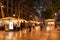 La Rambla in Barcelona at night with people.