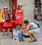 LA ROCHELLE, FRANCE - AUGUST 11, 2015: Street singers with musical instruments make performance on the street