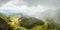 La Soufriere volcano crater panorama with tuff cone hidden in green and pouring rain, Saint Vincent and the Grenadines