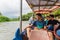 LA SUERTE, COSTA RICA - MAY 14, 2016: Passengers of a boat traveling from La Pavona to Tortuguero on La Suerte rive