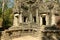 La tour Ouest et les sculptures du mur Sud  du temple Thommanon dans le domaine des temples de Angkor, au Cambodge