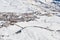 La Toussuire mountain village as seen from high up on the mountain, in Les Sybelles ski domain. Winter view on a sunny day