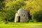 LaArdÃ¨che landscape in France. A dry stone hut is a type of country building, built entirely without