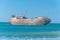 Laayoune port, Morocco, Western Sahara - January 6, 2019: a rusty shipwreck in the Atlantic Ocean. Copy space