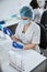 Lab technician assembling a laboratory tool for a blood test