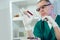 Lab technician assistant analyzing a blood sample at laboratory.