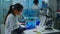 Lab technician doctor analyzing virus evolution looking on digital tablet