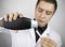 A lab technician examines a sample of shampoo he was given for analysis. Chemical analysis of the composition of detergents,