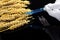 A lab technician holds a syringe with a chemical in his hands and tests wheat and grains for GMO. Wheat and grain tests for GMOs.