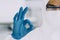 Lab Technician in Personal protective equipment  PPE suit Okey hand gesture