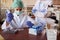 Lab technician with pipette taking sample of blood