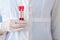 Lab worker holding test tubes with blood samples, closeup