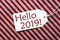 Label On Red Wrapping Paper, Text Hello 2019