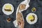 Labneh labaneh middle eastern soft white goat`s milk cheese with olive oil ,olives , za`atar , lemon, with woman hand holding o