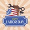Labor Day banner with stars, tools and a black female fist with a wrench and an American flag. American Labor Day