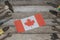 Labor Day in Canada. Canada flag on wooden boards with tools with copy space