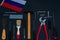 Labor Day Russia. Various tools and a flag on a black background