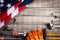 Labor Day, USA America flag with many handy tools on wooden background texture